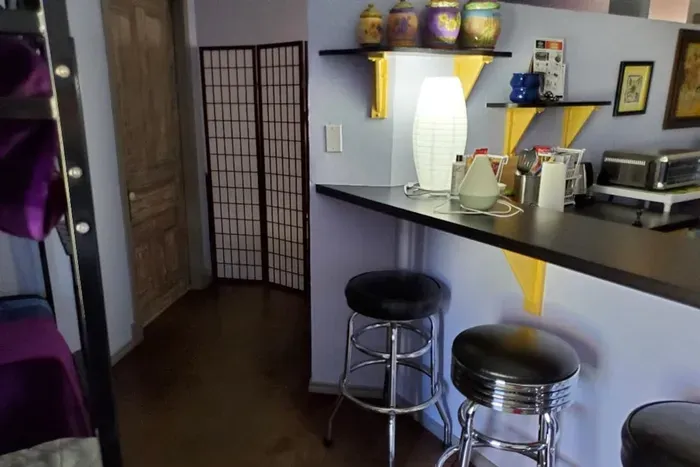 Features antique-style door, pedestal sink, and updated shower — a clean and stylish space to refresh.