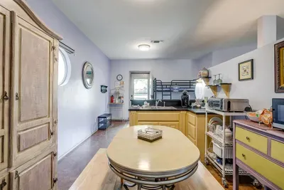 Kitchen is fully stocked with dishes, utensils, and cooking basics for your convenience.