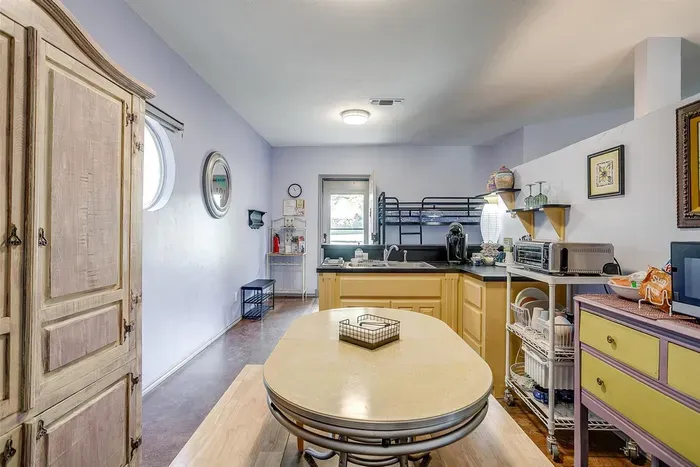 Kitchen is fully stocked with dishes, utensils, and cooking basics for your convenience.