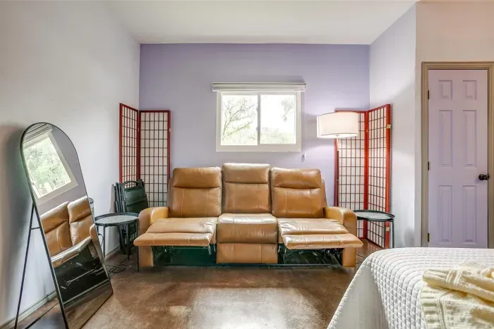 Recliner couch offers additional comfort for lounging, reading, or relaxing indoors after a full day outdoors.