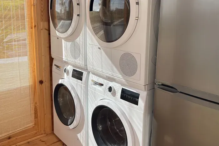 Two washers and two dryers in the laundry shed :)