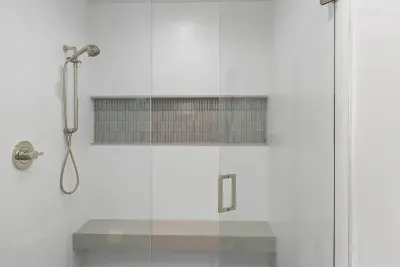 Walk-in shower with a bench