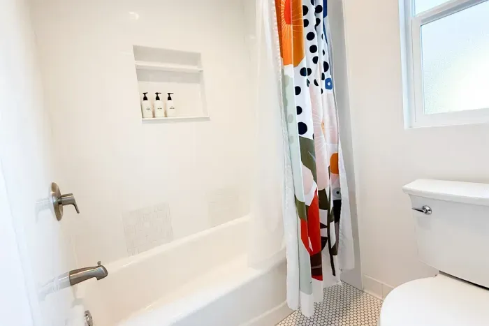 Full bath and shower equipped with Body Wash, Shampoo and Conditioner