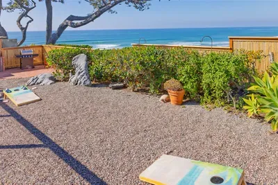 Enjoy a game of cornhole while gazing at the ocean