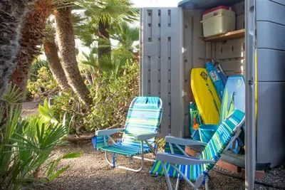 Beach gear shed - boogie boards/umbrellas/chairs/sand toys/cooler and a beach mat