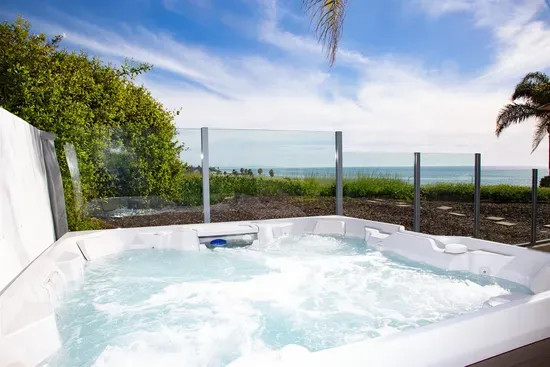 Relax in the spa with stunning ocean views on the first floor patio