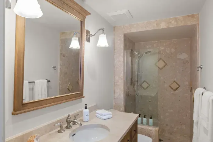 Second full bathroom with walk in shower off of the living room