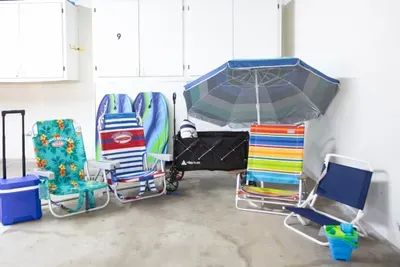 Provided beach essentials including a wagon in our storage in front of your dedicated garage parking space