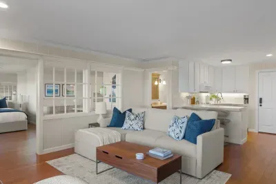 Open concept living space seamlessly connects the living room, kitchen and bedroom