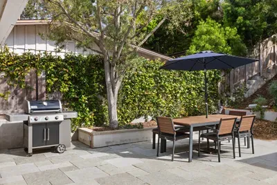 Grill and dine in your spacious back yard