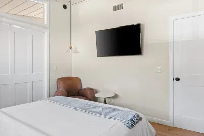 Guest bedroom one off of the living room with doors shut