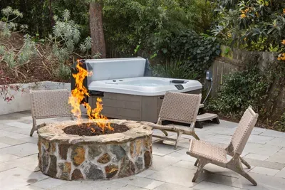 Light up the fire pit and soak in the hot tub