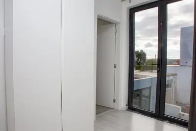 Closet and primary ensuite bathroom door