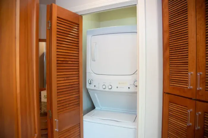 Washer & Dryer behind bi-fold doors in the bathroom