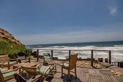 Lounging area down the stairs to the beach is open to the complex