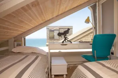 The loft is above the king bed in the Primary bedroom