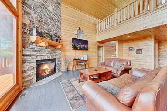 Beautiful stone gas fireplace that extends into the ceiling.