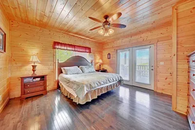 Large doors leading straight out to deck from bedroom