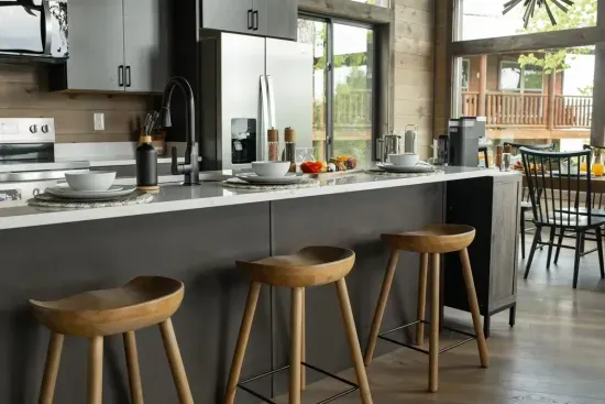 Wake up and pull up a seat—this oversized island is perfect for breakfast in the cabin