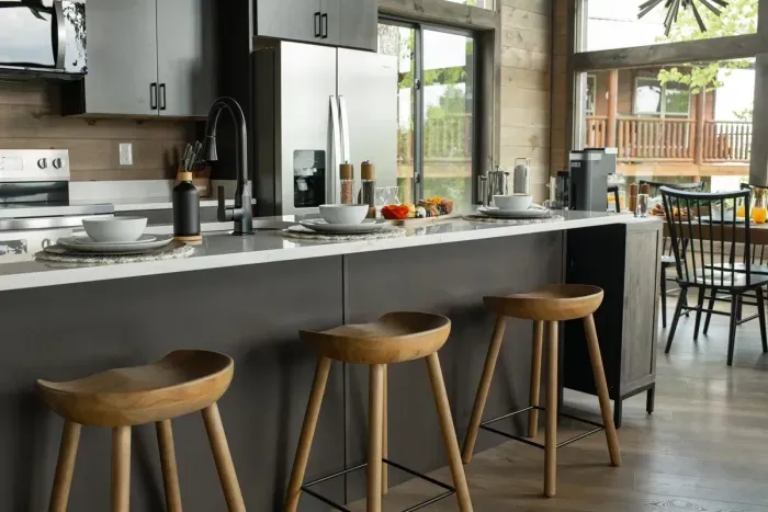 Wake up and pull up a seat—this oversized island is perfect for breakfast in the cabin
