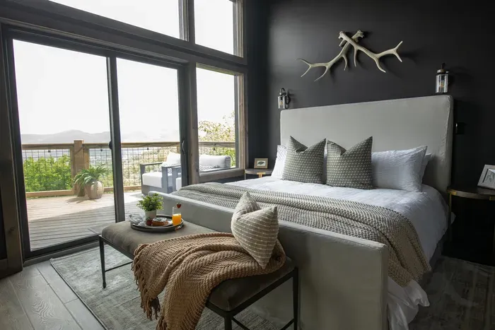 Wake up to breathtaking mountain views and step onto your private deck with a cozy outdoor fireplace