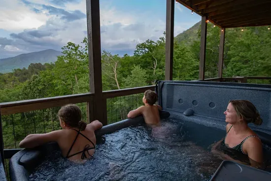 Soak in the hot tub while taking in breathtaking mountain views
