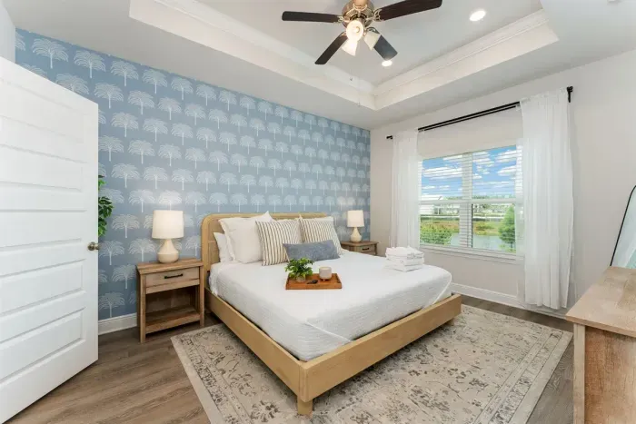 Enjoy the comfort of the master suite featuring a king bed and peaceful views overlooking the pond