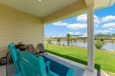 Relax in the patio rocking chair and take in the serene pond views—an ideal spot to slow down and unwind