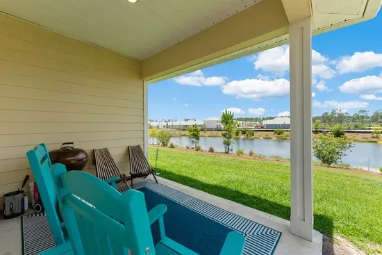 Relax in the patio rocking chair and take in the serene pond views—an ideal spot to slow down and unwind
