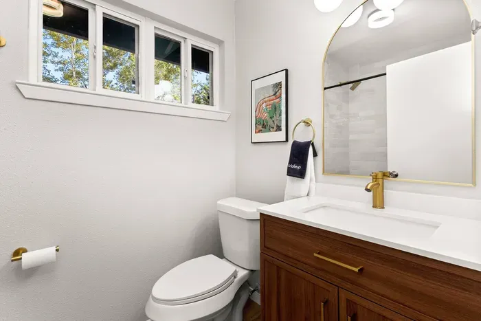 full bathroom with tub/shower combo + essentials