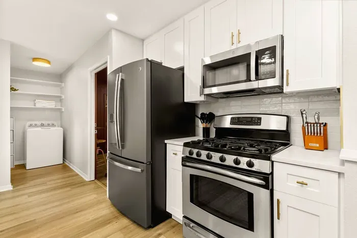 fully stocked kitchen with stainless steel appliances