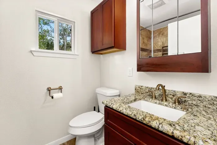 full bathroom with walk-in shower + essentials