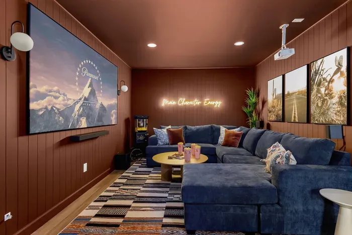 movie theater room with surround sound + pull-out queen sofa bed