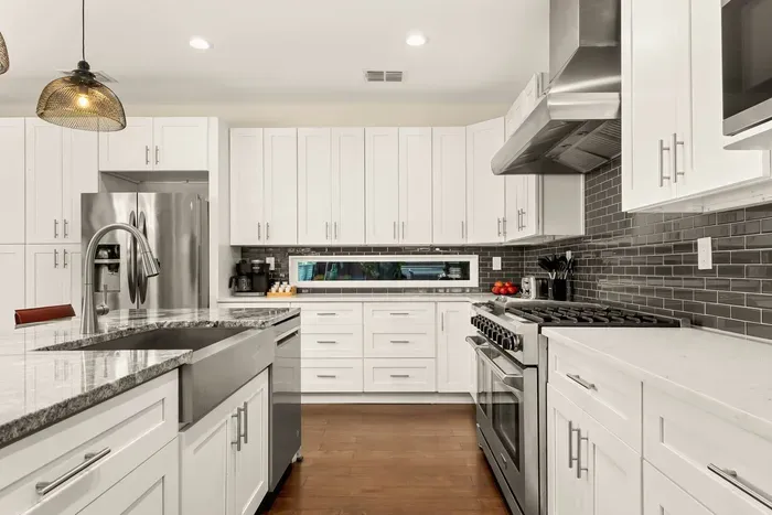 fully stocked gourmet kitchen with dedicated coffee station, 6-burner chef's range, and a double oven