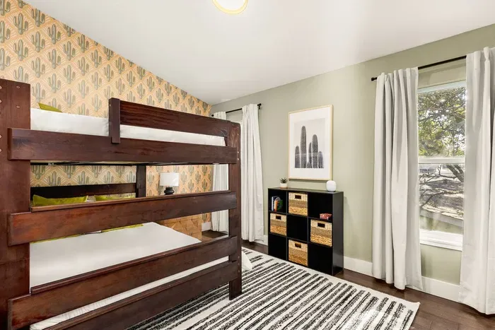 queen-over-queen bunk room with toys & games