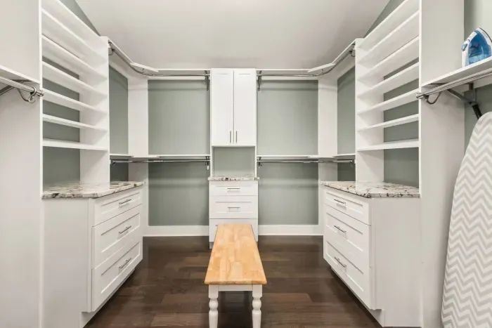 oversized master closet with iron & ironing board