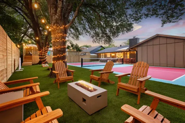 Backyard with pool and pickleball court at Cowgirl Casa, a group-friendly Austin luxury rental