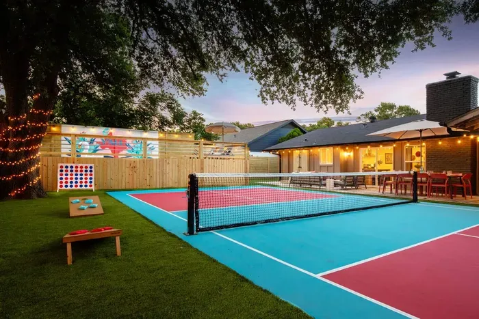 Plenty of games in the backyard with pickleball, corn hole, and giant Connect 4!