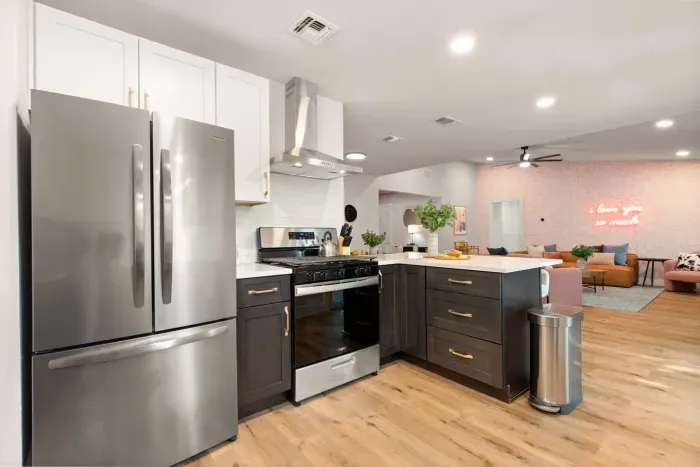 Fully stocked kitchen with all new stainless steel appliances, cookware, utensils, plates, bowls, cutting boards, flatware, glassware, knife set, & kettle