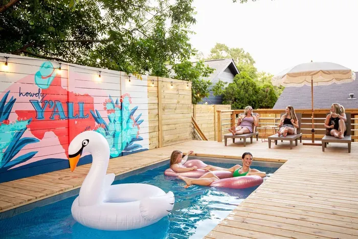 Room for everyone by the pool with loungers and umbrellas!