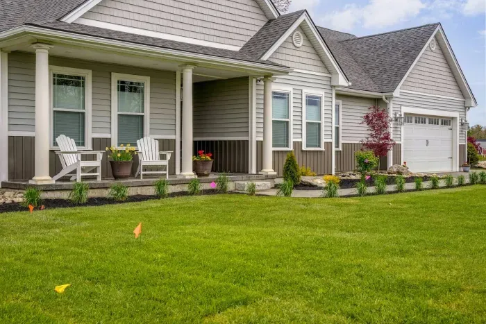 Enjoy the expansive outdoor space with a sunny lawn, patio dining set, Adirondack chairs, and a grill—perfect for barbecues, relaxing afternoons, and memorable evenings with friends and family.
