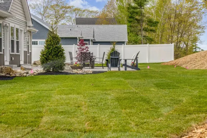 Enjoy the expansive outdoor space with a sunny lawn, patio dining set, Adirondack chairs, and a grill—perfect for barbecues, relaxing afternoons, and memorable evenings with friends and family.