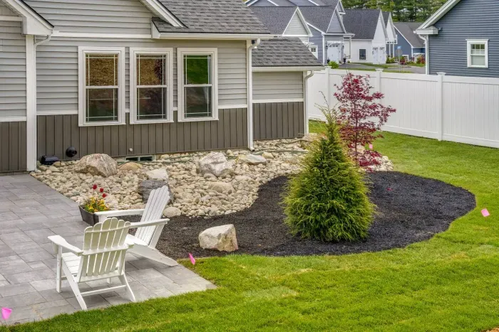 Enjoy the expansive outdoor space with a sunny lawn, patio dining set, Adirondack chairs, and a grill—perfect for barbecues, relaxing afternoons, and memorable evenings with friends and family.