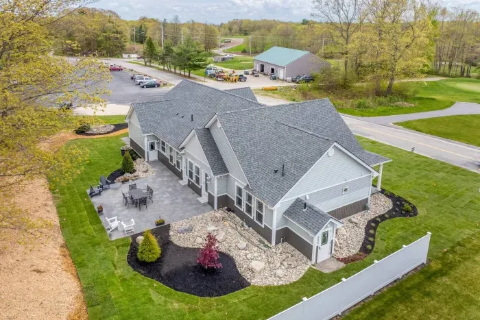 Enjoy the expansive outdoor space with a sunny lawn, patio dining set, Adirondack chairs, and a grill—perfect for barbecues, relaxing afternoons, and memorable evenings with friends and family.