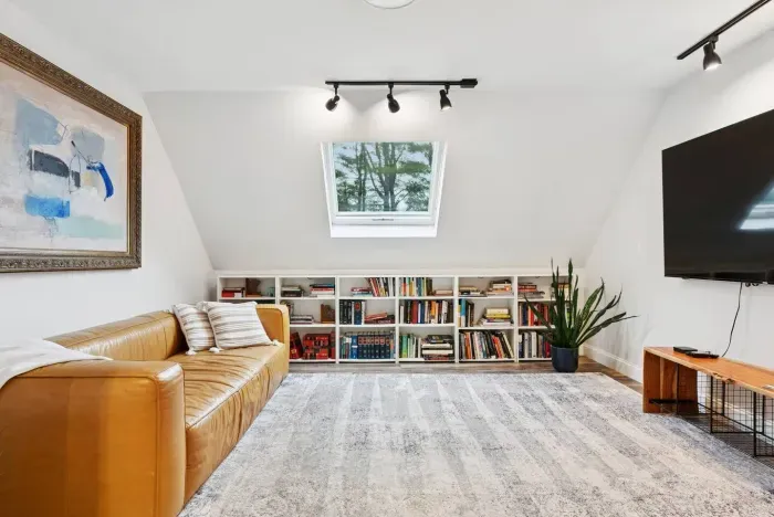Lounge in the beautiful light filled living room. Equipped with Roku TV (use your logins for apps) and an endless supply of books to cozy up and relax. 