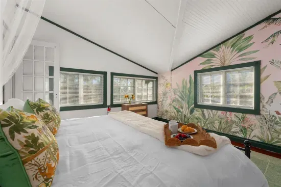 Family room with the bunk room leading off it with crib