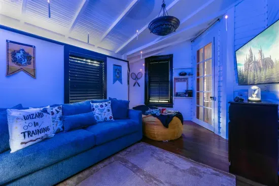 Immerse yourself in the magic of the Harry Potter Games Room, complete with floating candles, themed decor, and soft lighting for an enchanting ambiance.