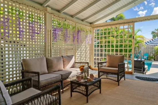 Enjoy a quiet morning or a romantic evening in the poolside seating area, shaded by palms and surrounded by natural beauty.