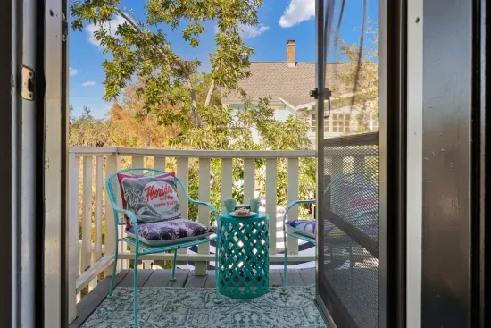 Step onto your personal balcony for morning coffee with a view of the surrounding treetops.