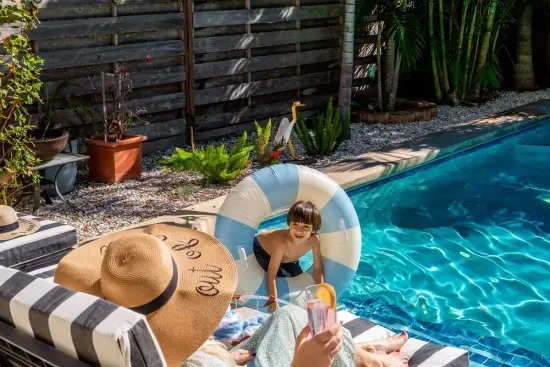 Take a dip in the heated pool or relax poolside with a cocktail in hand. The striped umbrellas and loungers add a touch of resort-style luxury.